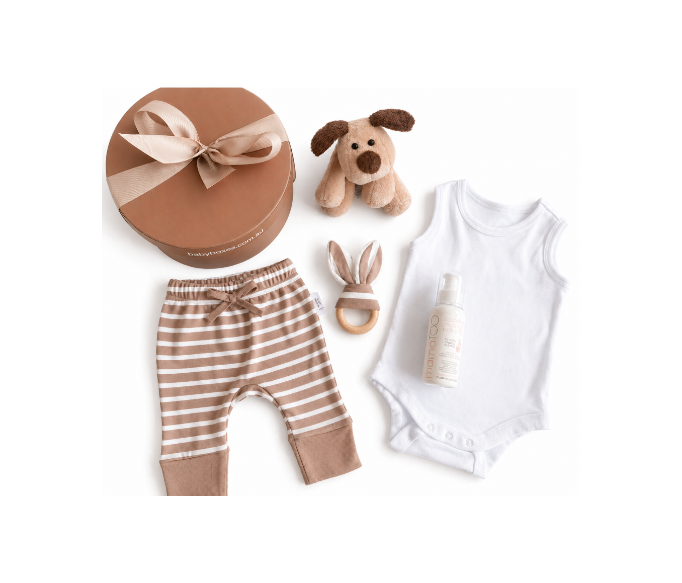 Baby clothing and toys including striped pants, a white onesie, a plush dog toy, a rattle, and a bottle on a white background.