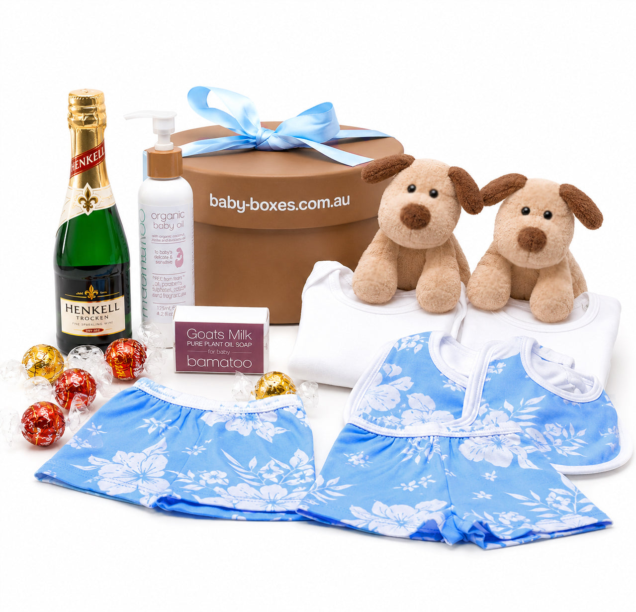 Baby gift set with Henkel champagne, baby clothes, and toys on a white background