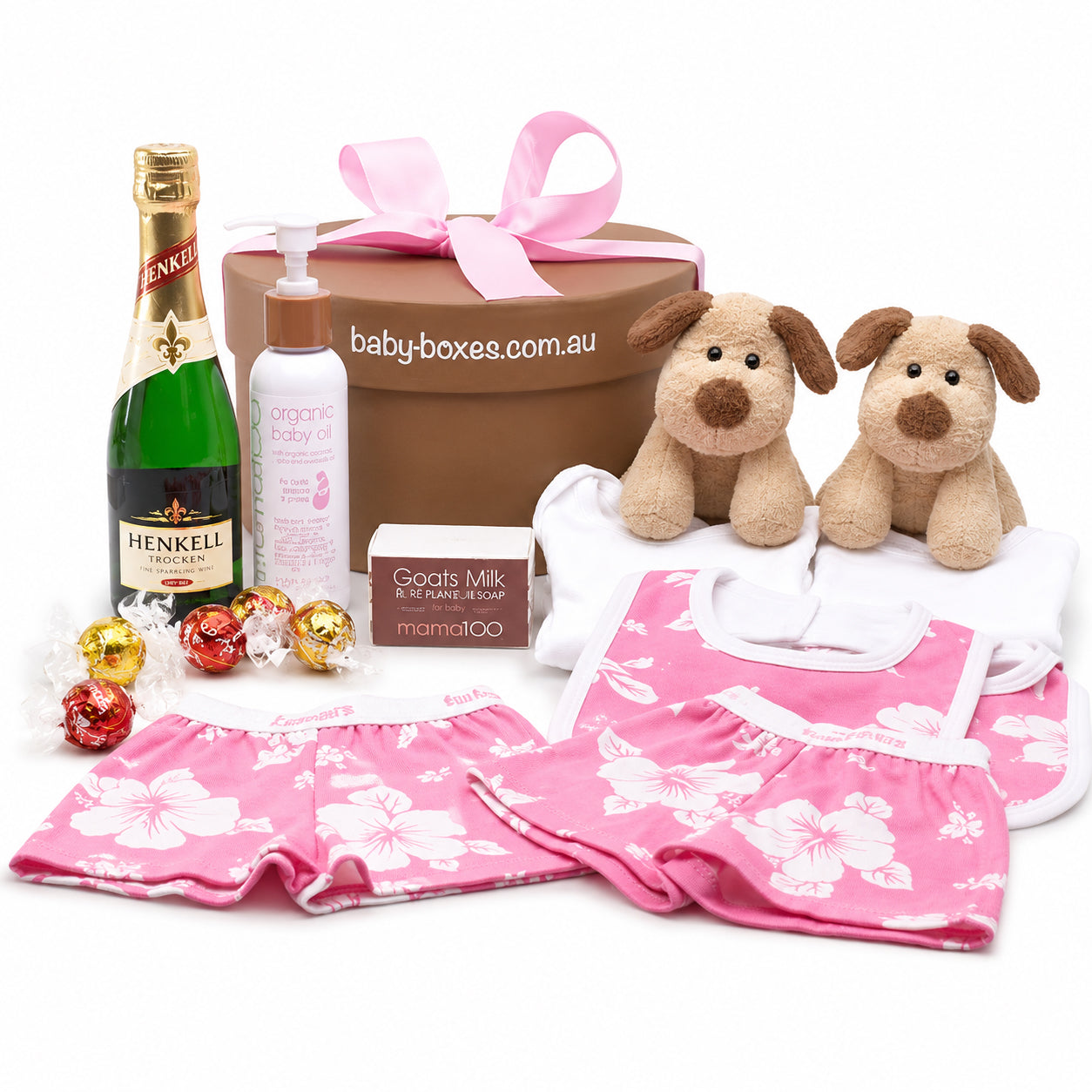 Baby gift set with Henkel bottle, teddy bears, and baby clothes on a white background
