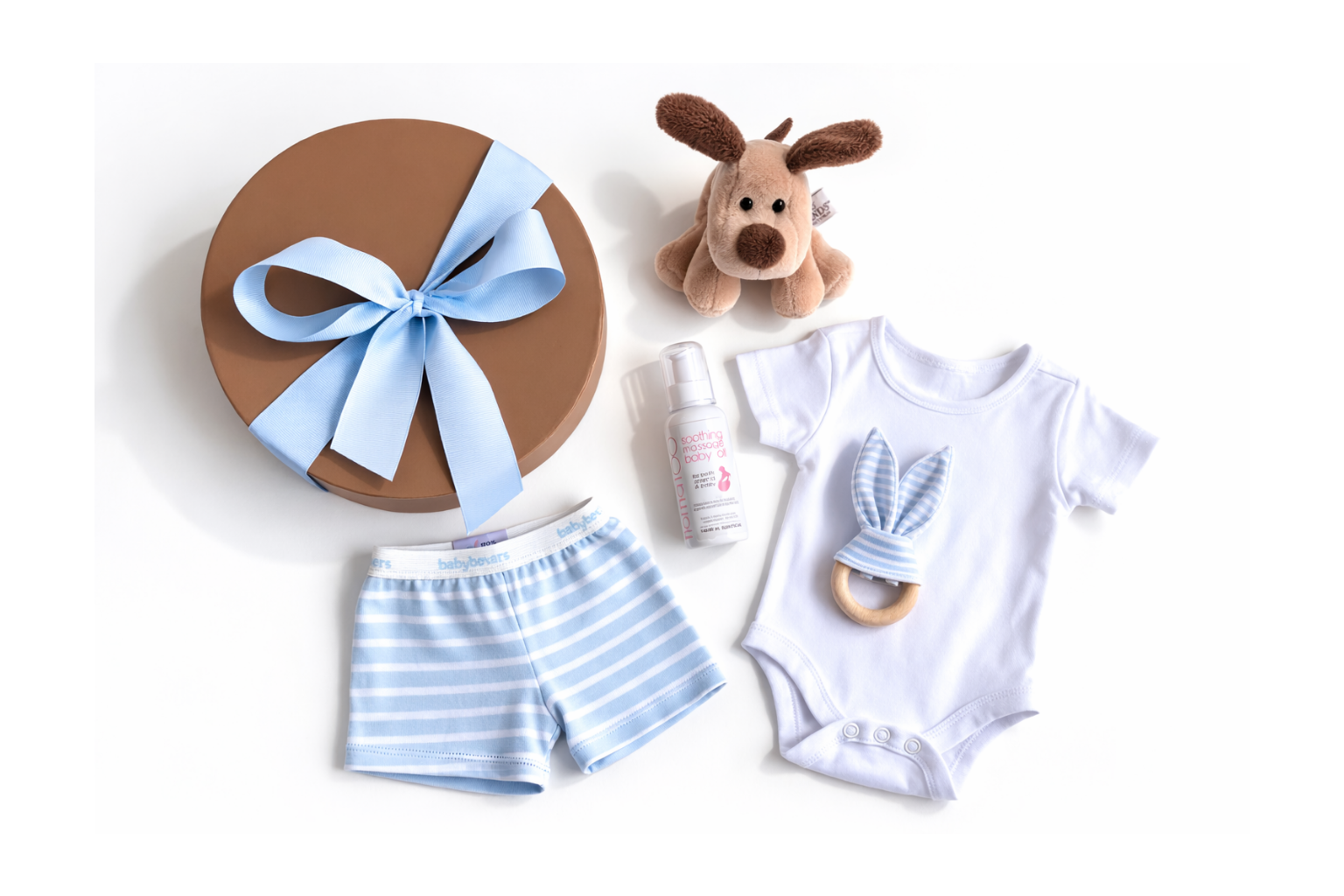 Baby clothing and items including shorts, onesie, and toy on a white background